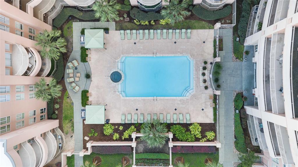 a aerial view of a house with garden space and seating area