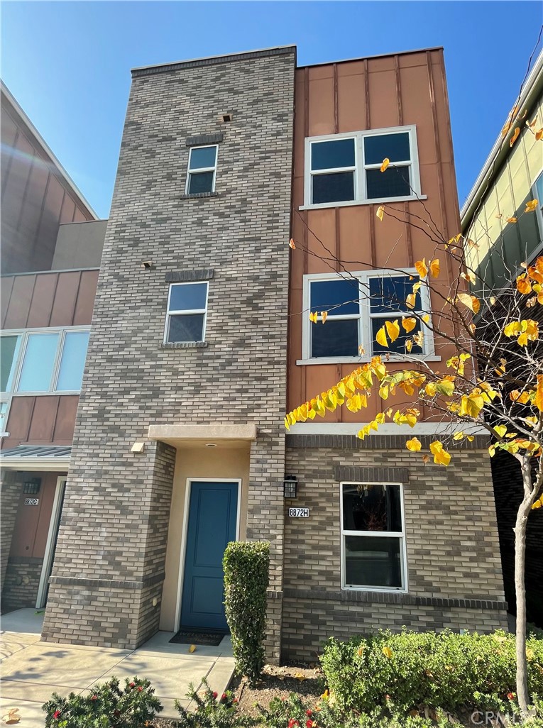 a brick building with a door and a window