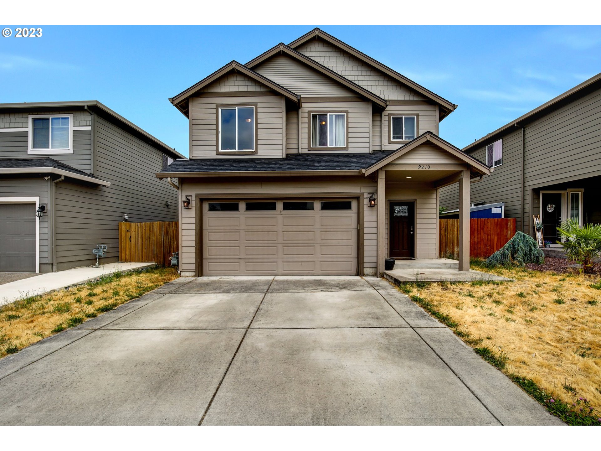 a front view of a house with a garage