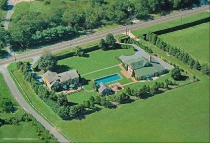 an aerial view of a garden with houses