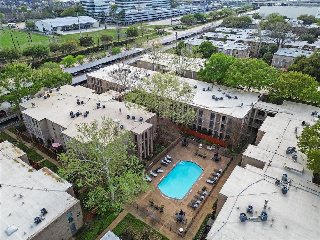 an aerial view of a house with a swimming pool yard and outdoor seating