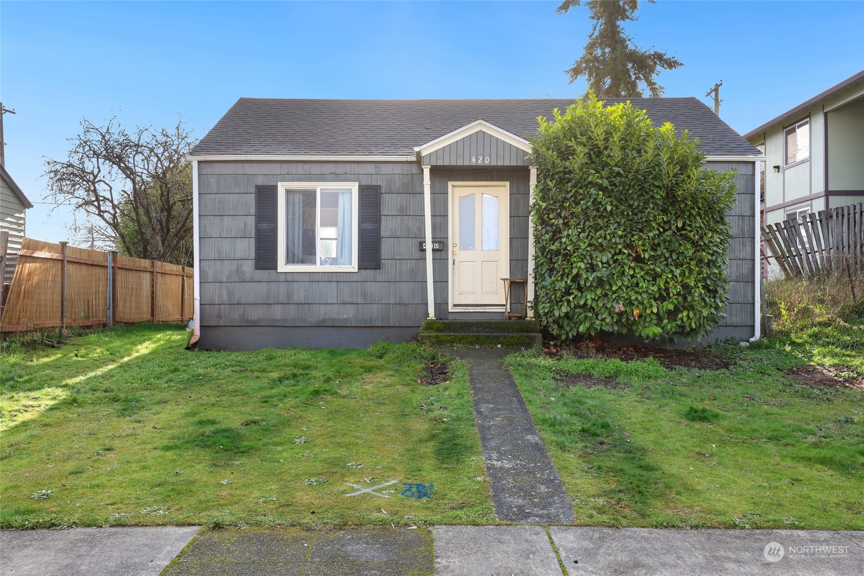 front view of a house with a yard