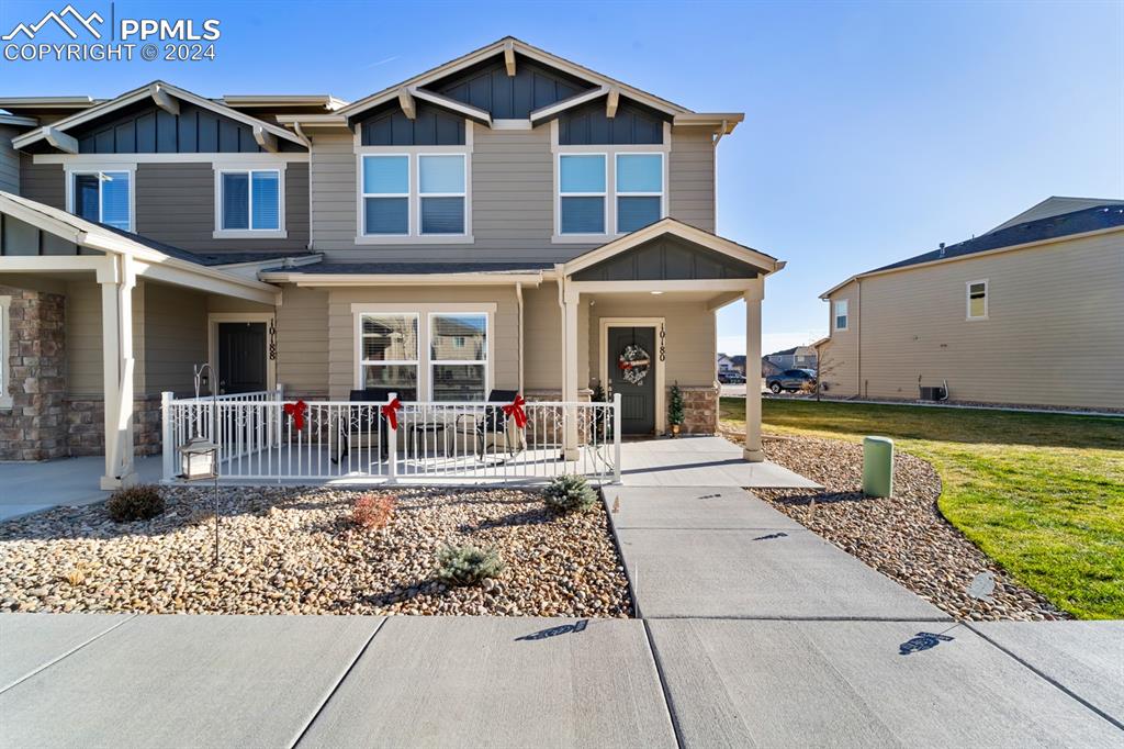 Craftsman-style house with a porch and a front yard