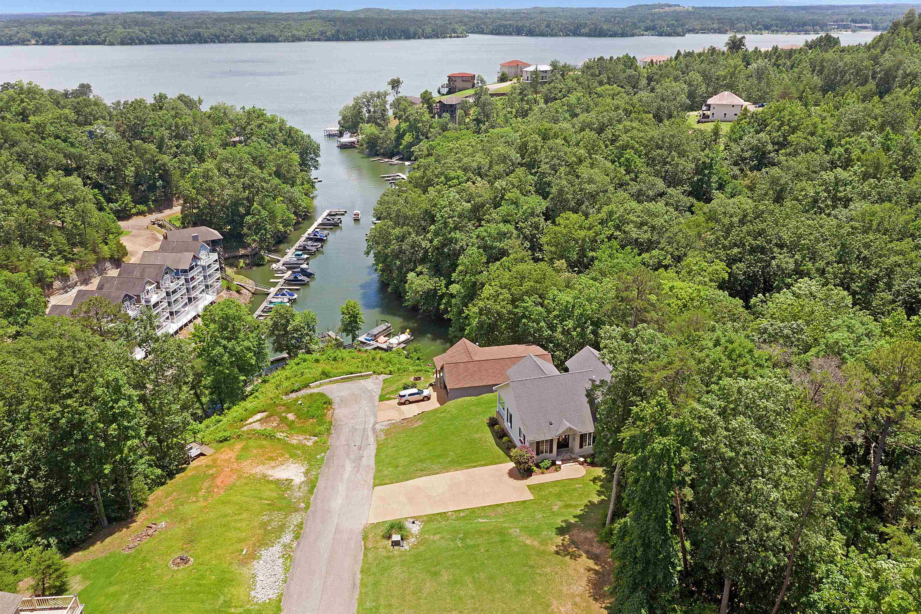 an aerial view of a house with a garden and swimming pool