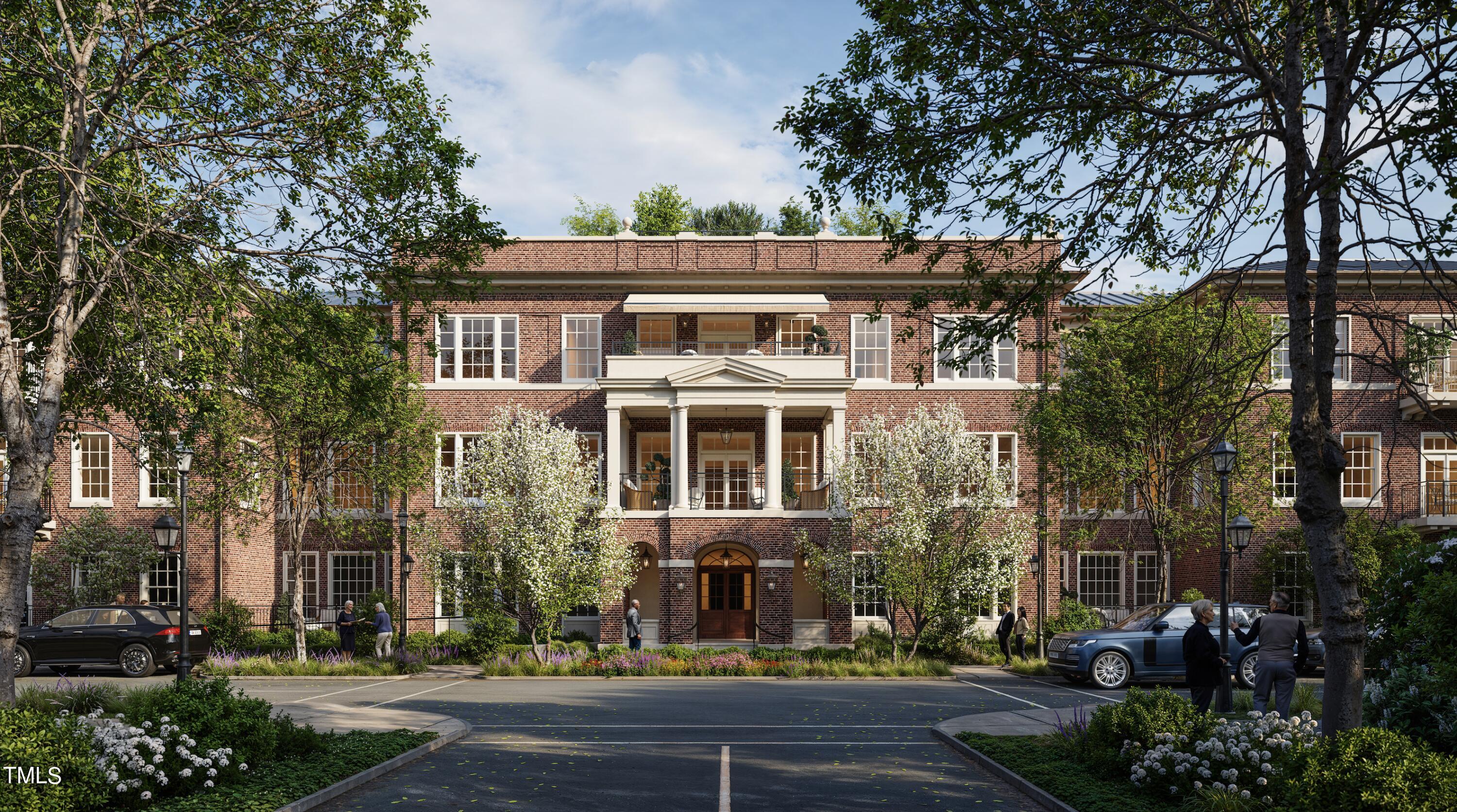 front view of a building with a garden