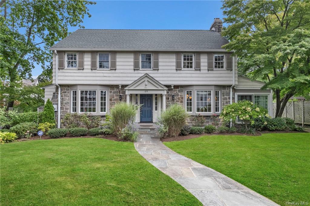 front view of a house with a yard