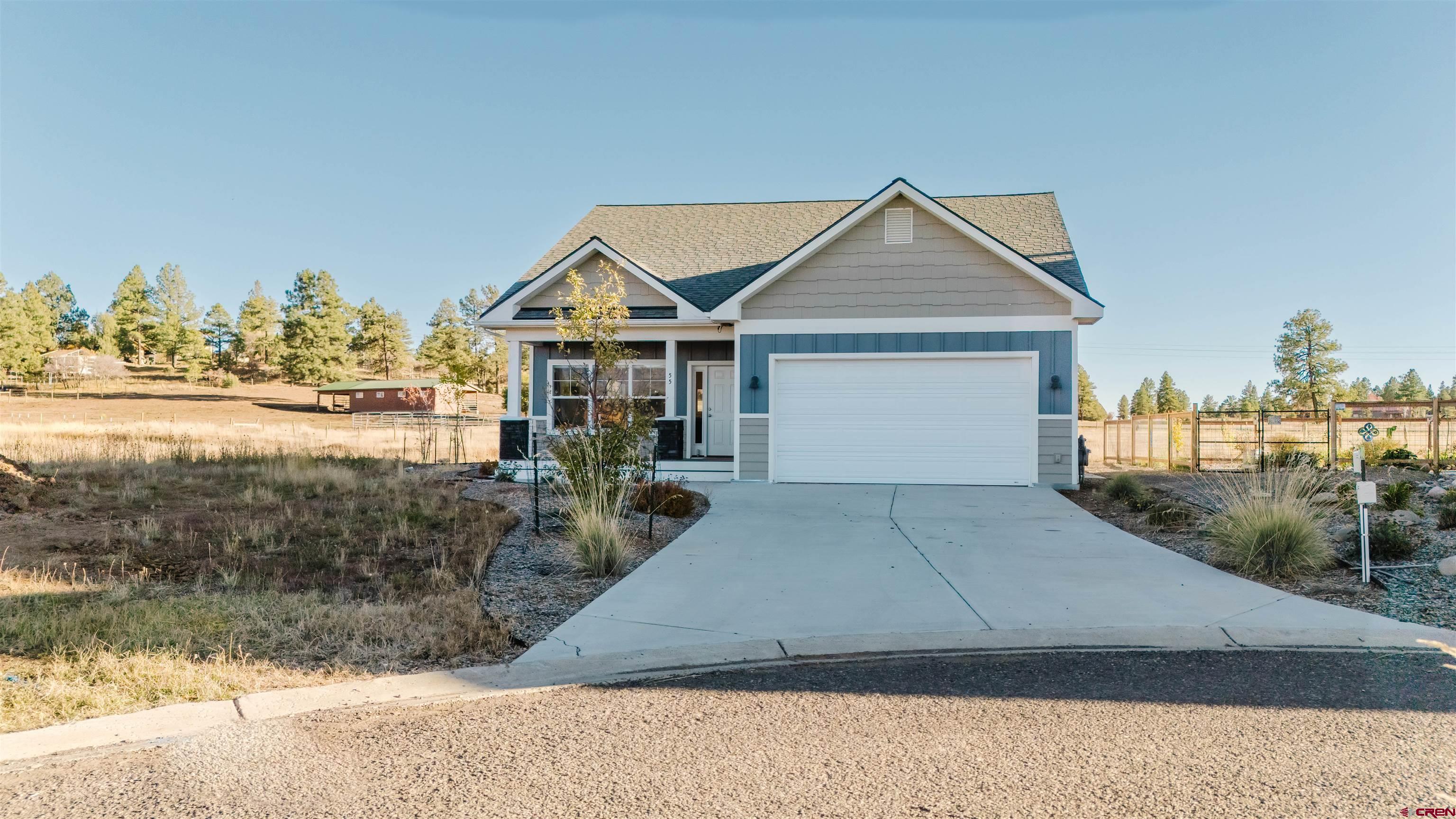 a view of a house with a yard