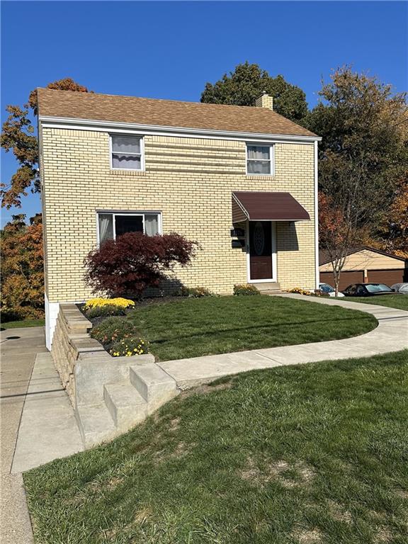 Perfectly level entrance with newer sidewalks, driveway and retaining wall