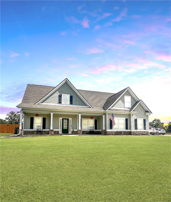 a front view of a house with a yard