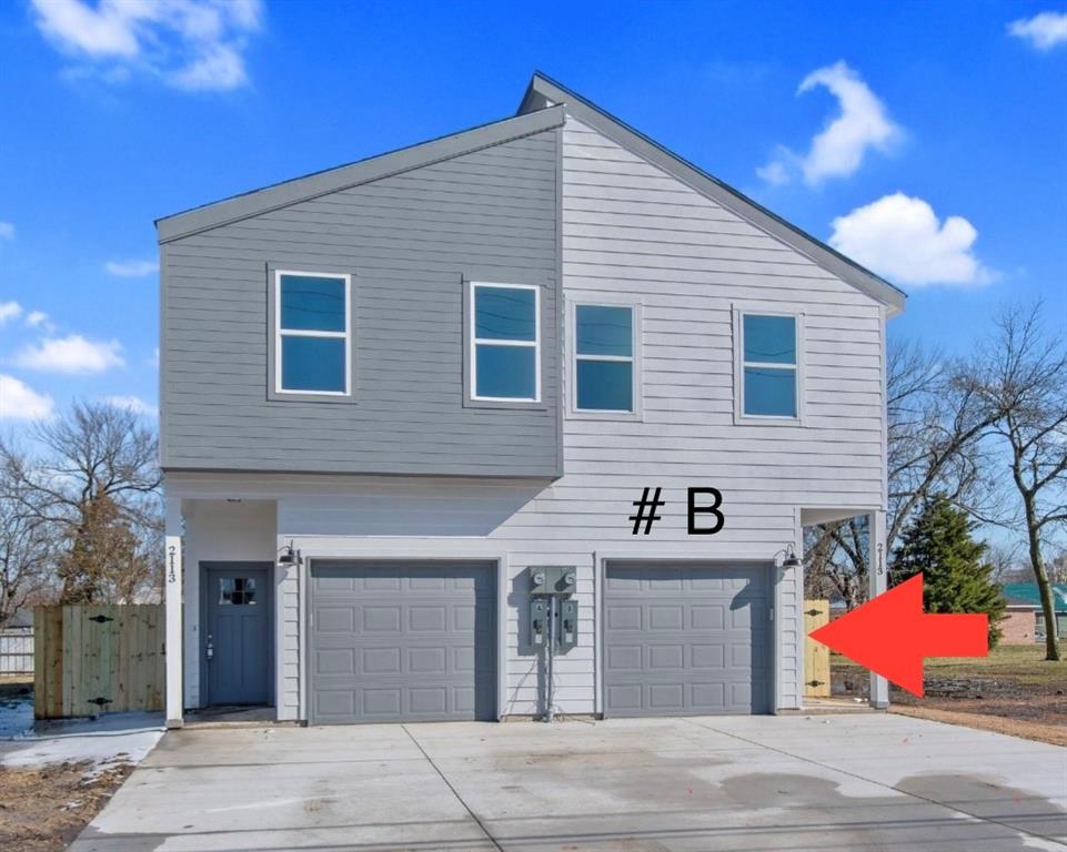 a front view of a house with garage