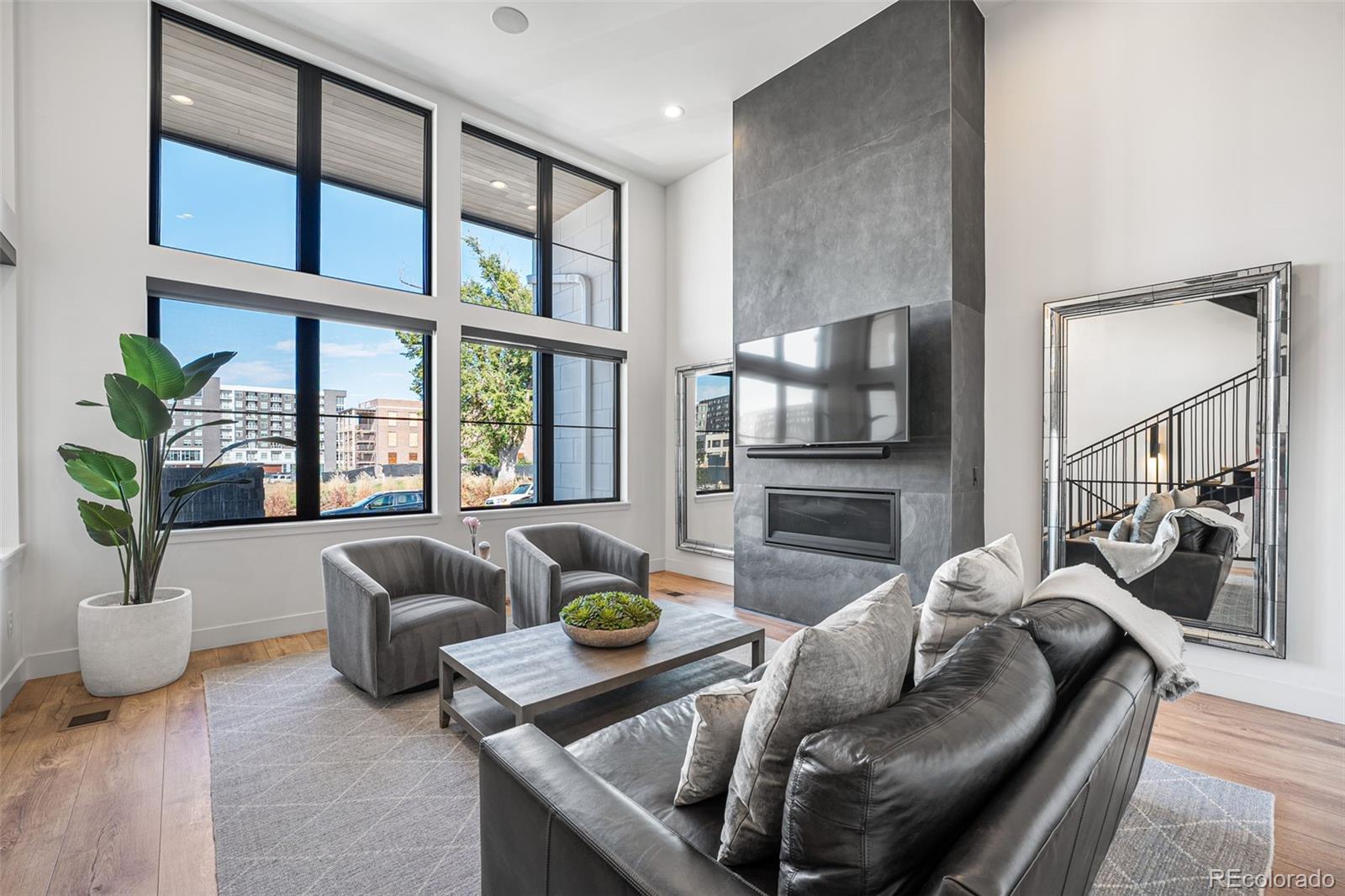 a living room with furniture fireplace and a flat screen tv