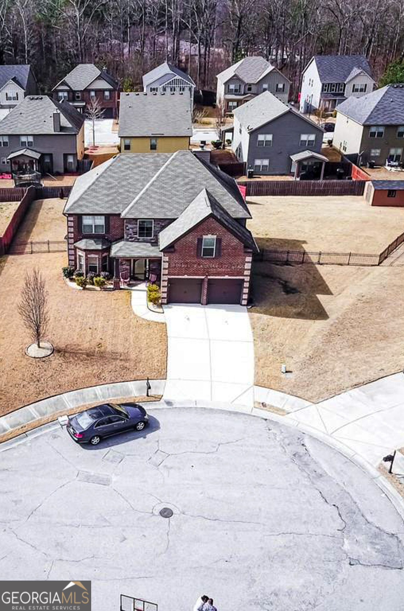 a view of multiple houses with a street