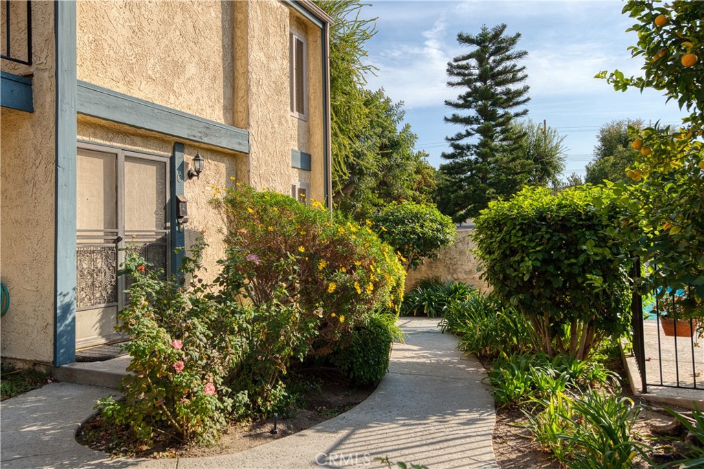 a view of a pathway both side of the house