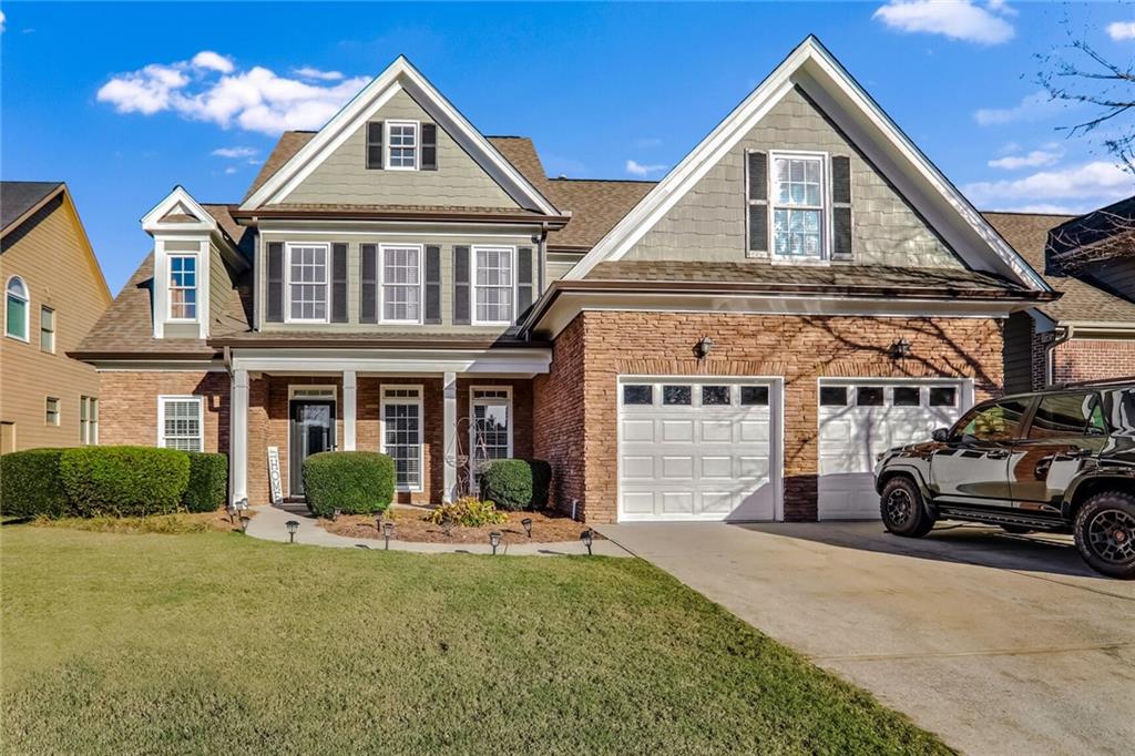 a front view of a house with a yard