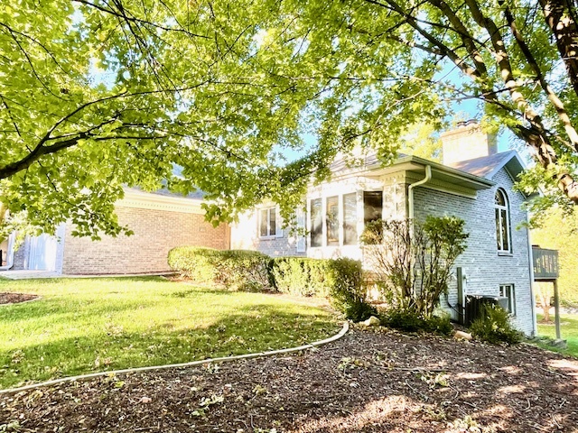 a view of a house with a yard