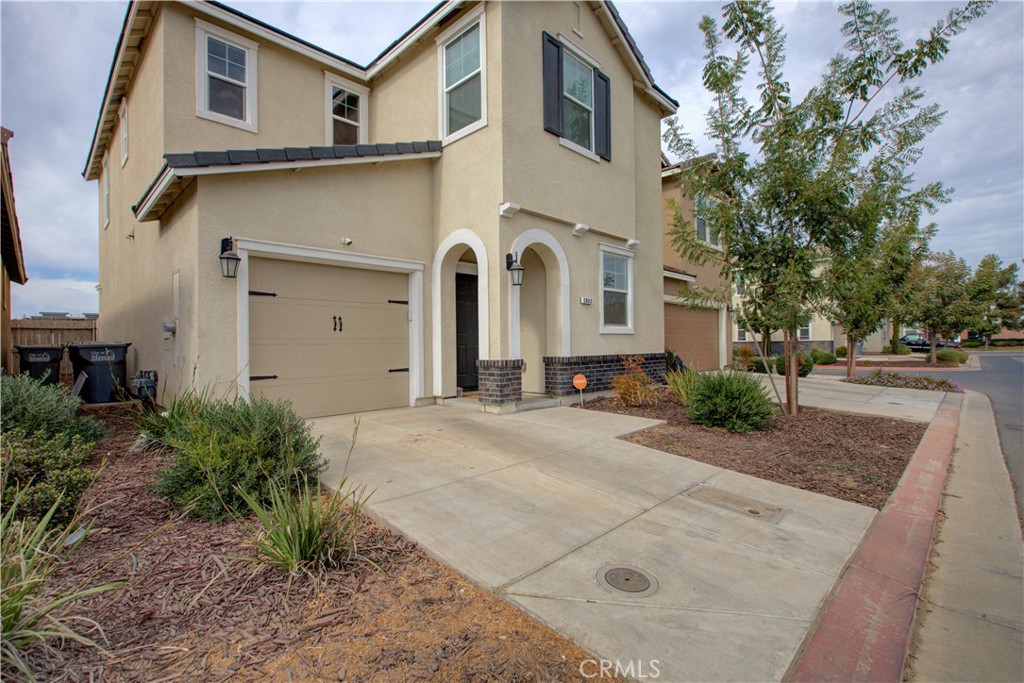 a front view of a house with yard