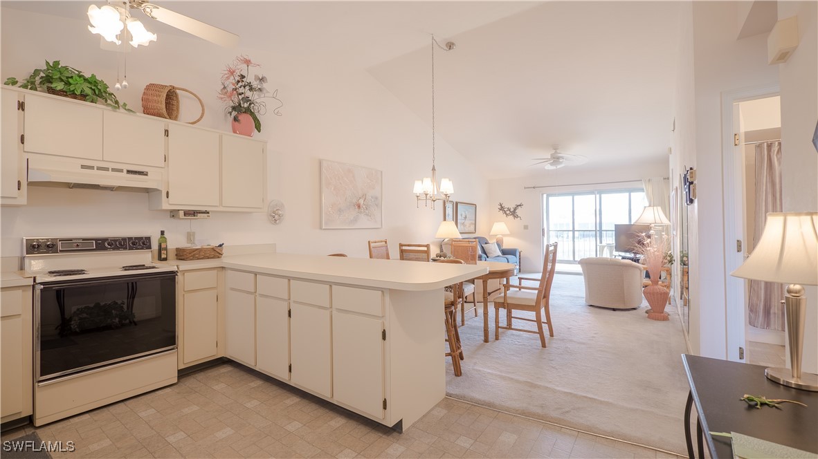 a kitchen with a stove a sink and a refrigerator