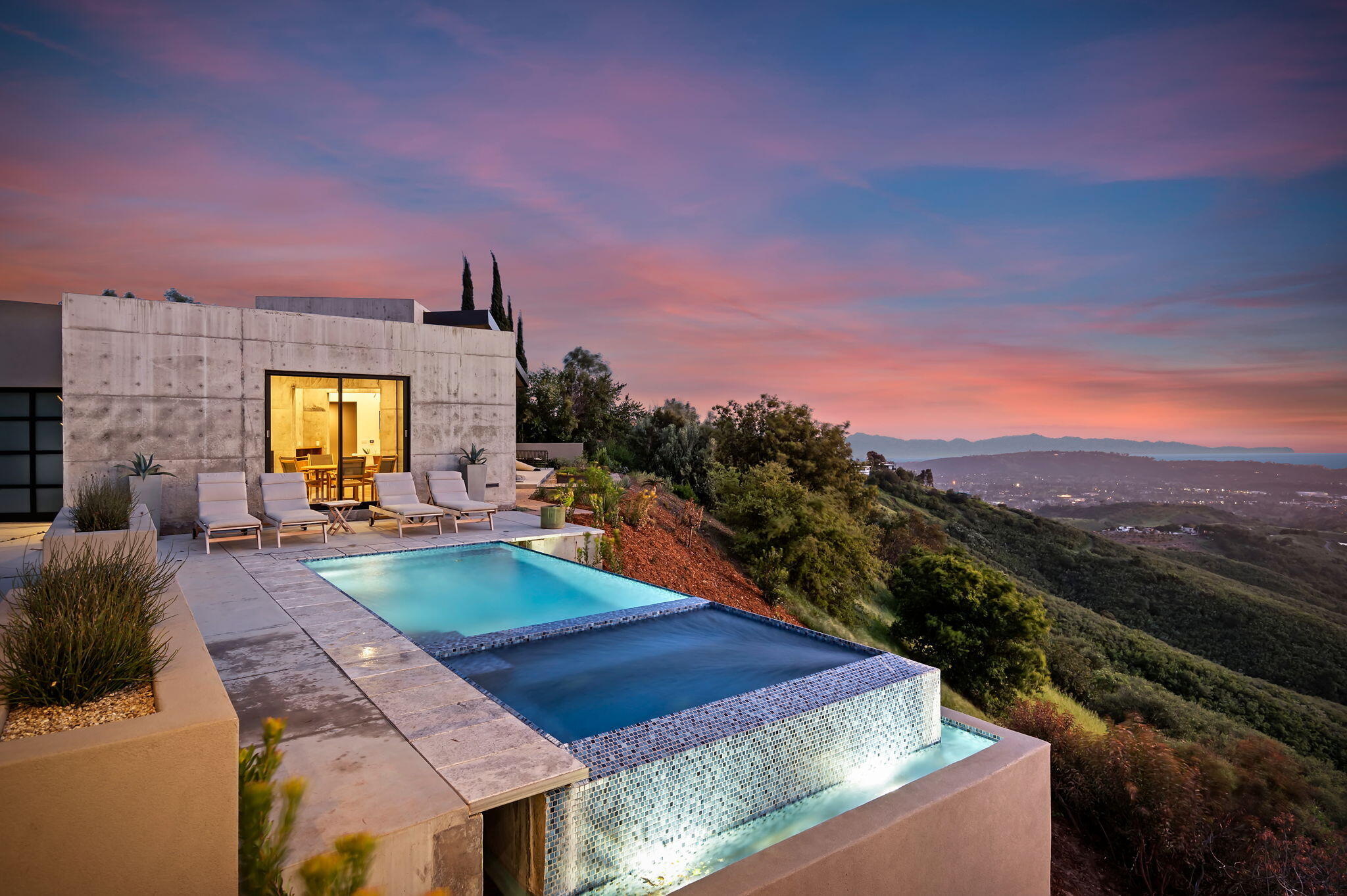 a swimming pool with outdoor seating and yard