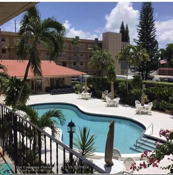 a view of a swimming pool with a patio