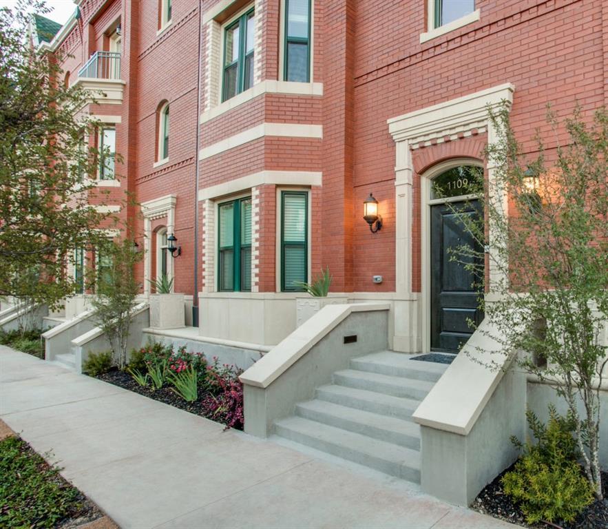 a front view of a building with potted plants