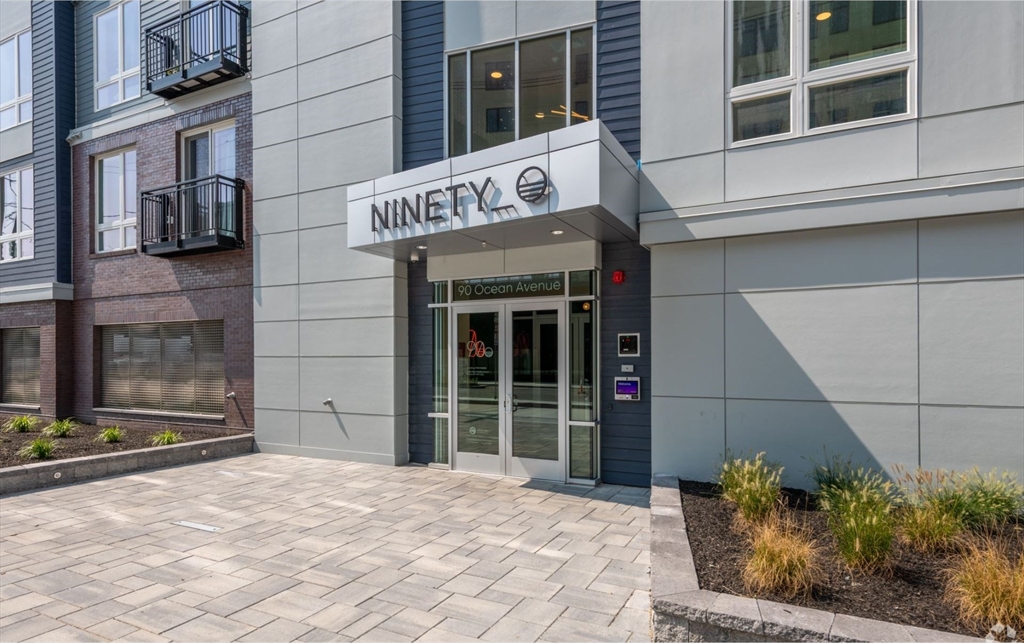 a view of a entryway with a building in the background