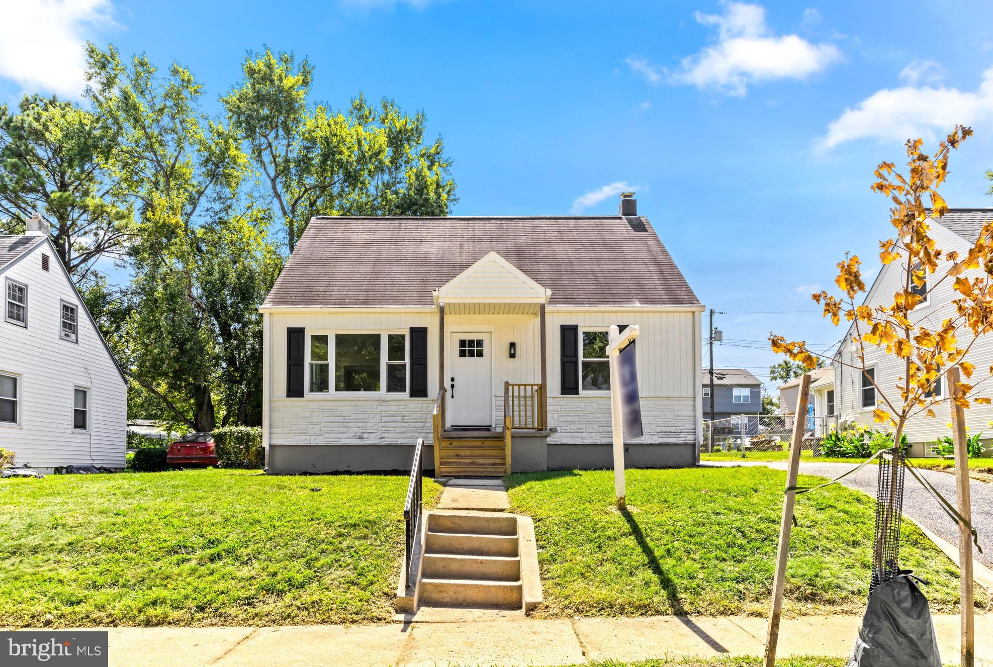 a front view of house with garden