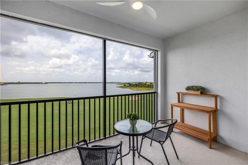 a view of a two chairs in the balcony