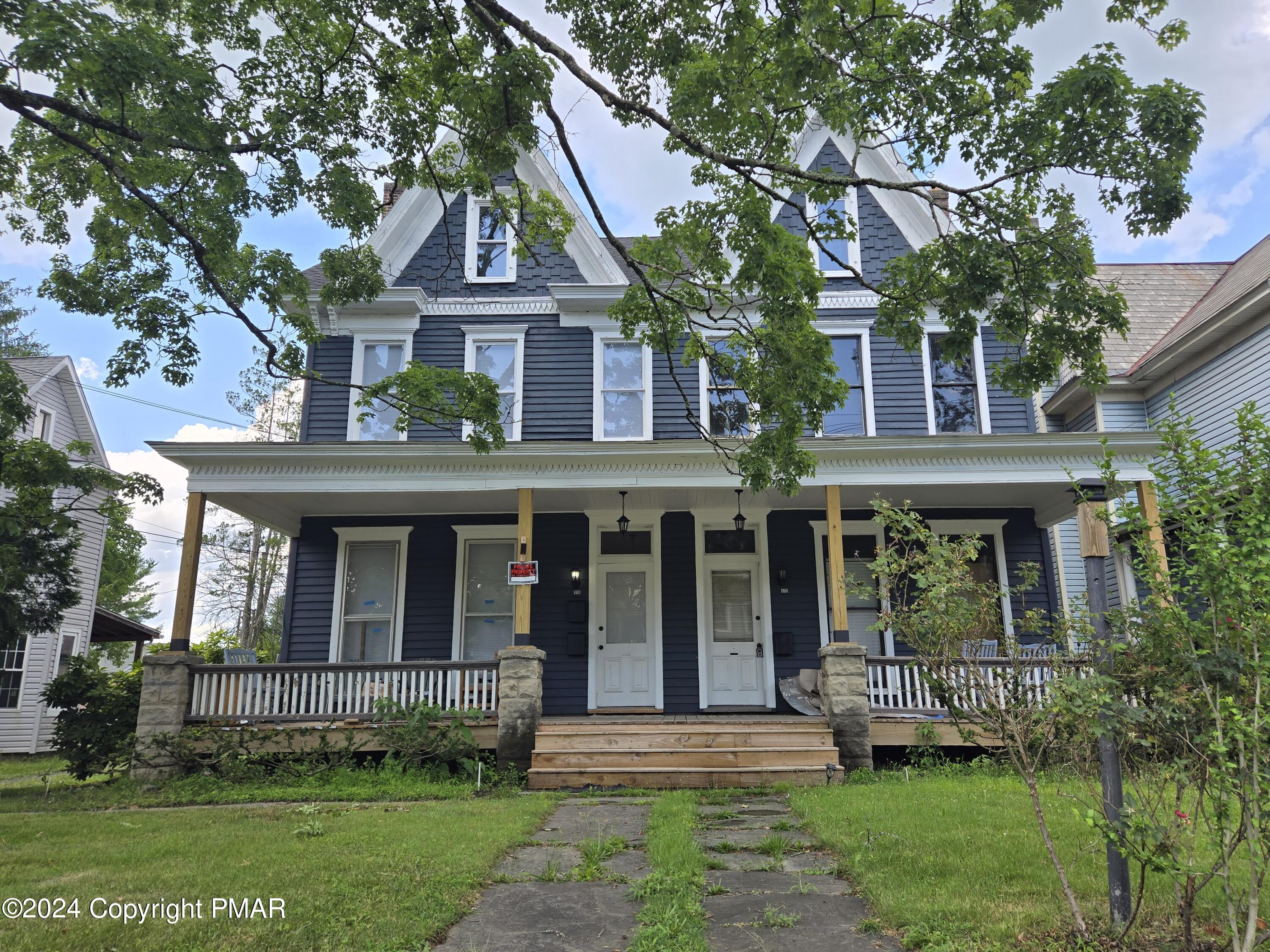 front view of a house with a yard