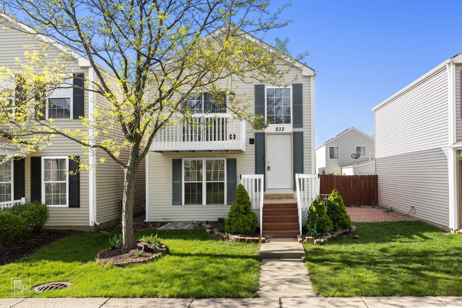 front view of a house with a yard