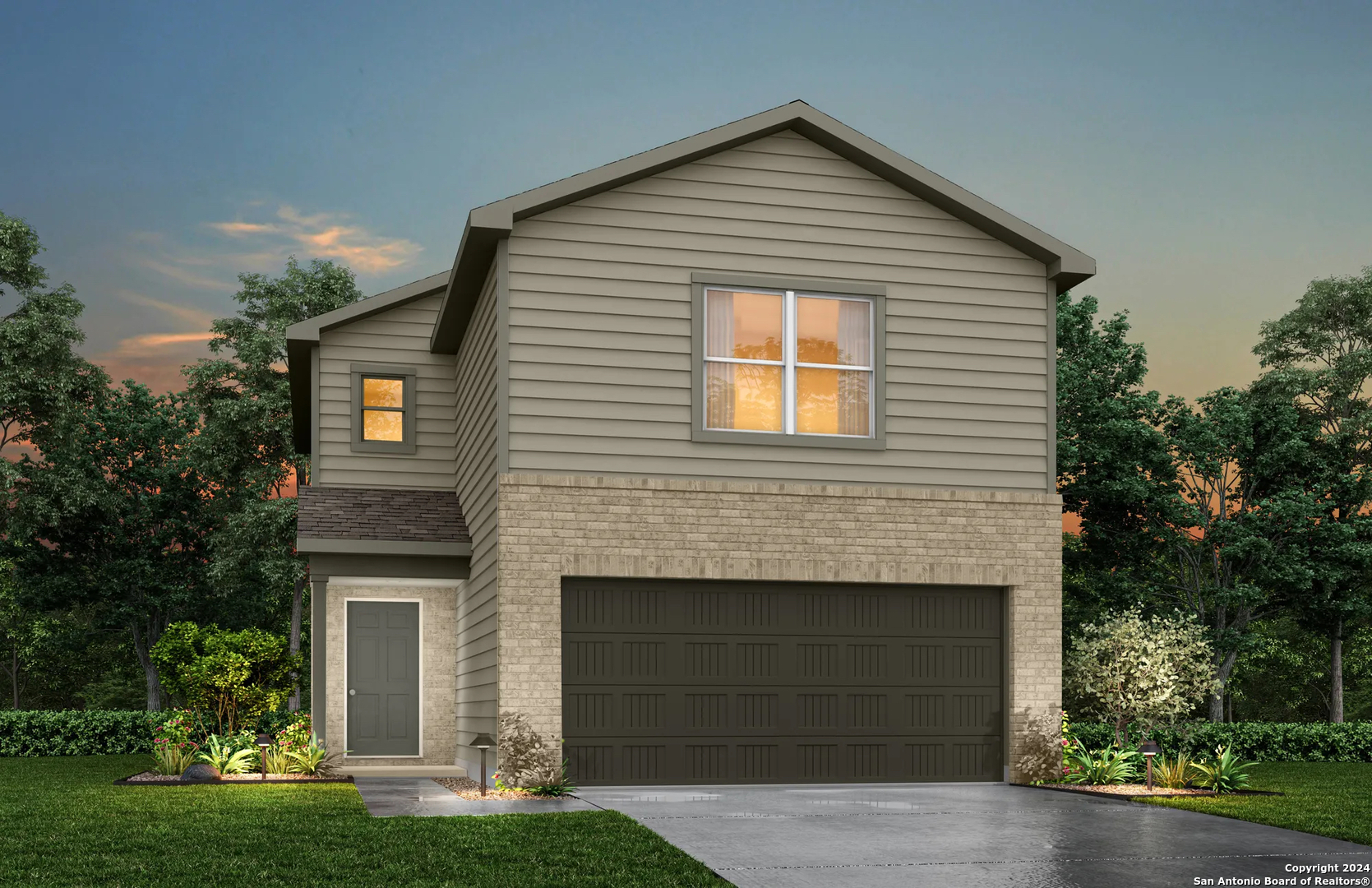 a front view of a house with a yard and garage