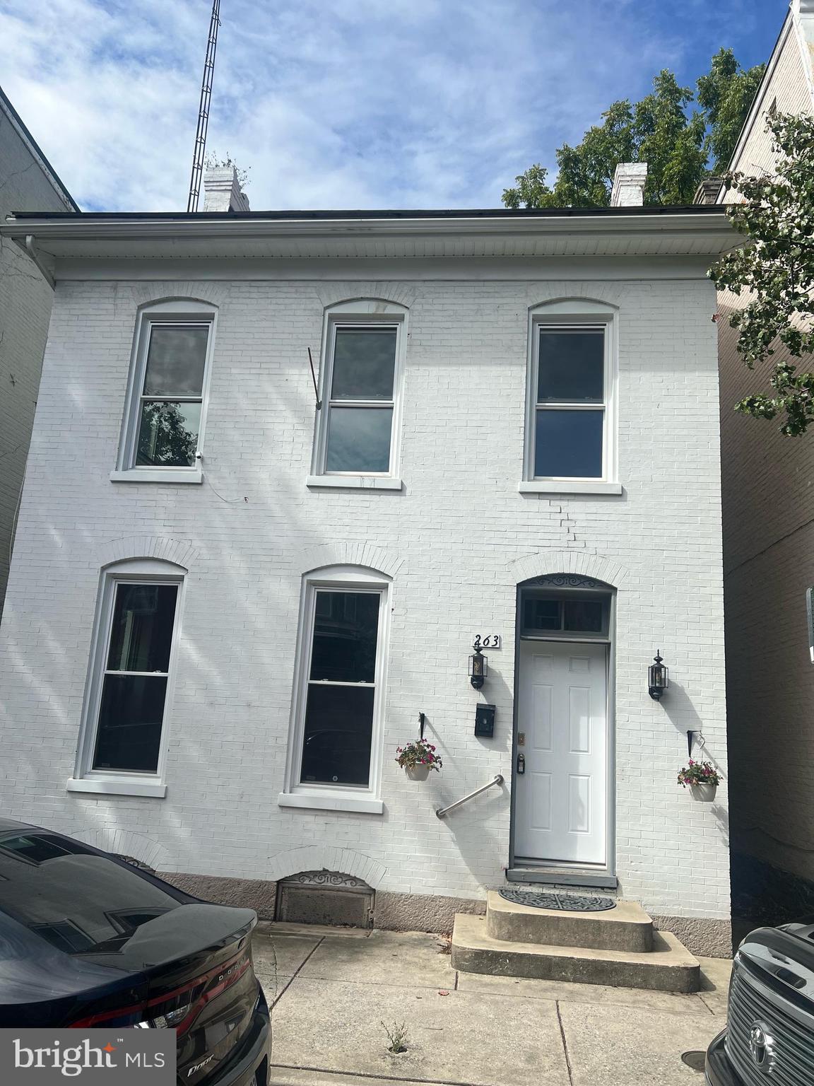 a front view of a house with yard