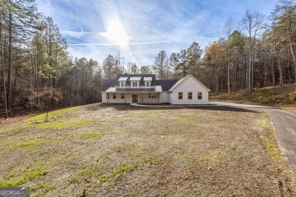 a house view with a wooden fence