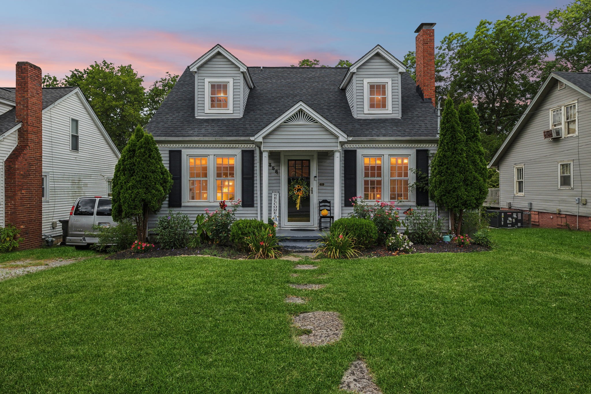 a front view of a house with a yard