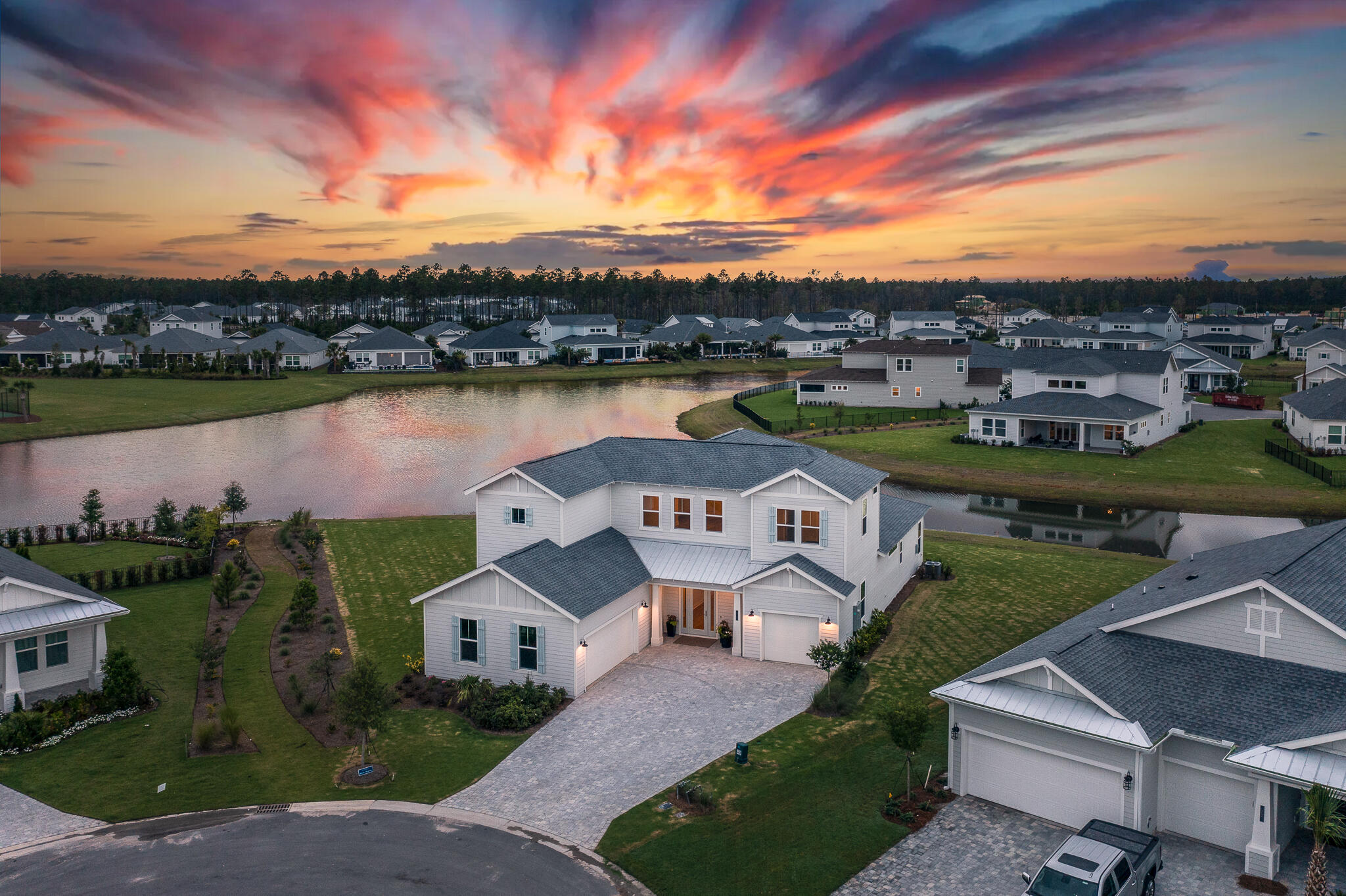 an aerial view of a house with a lake view and mountain view