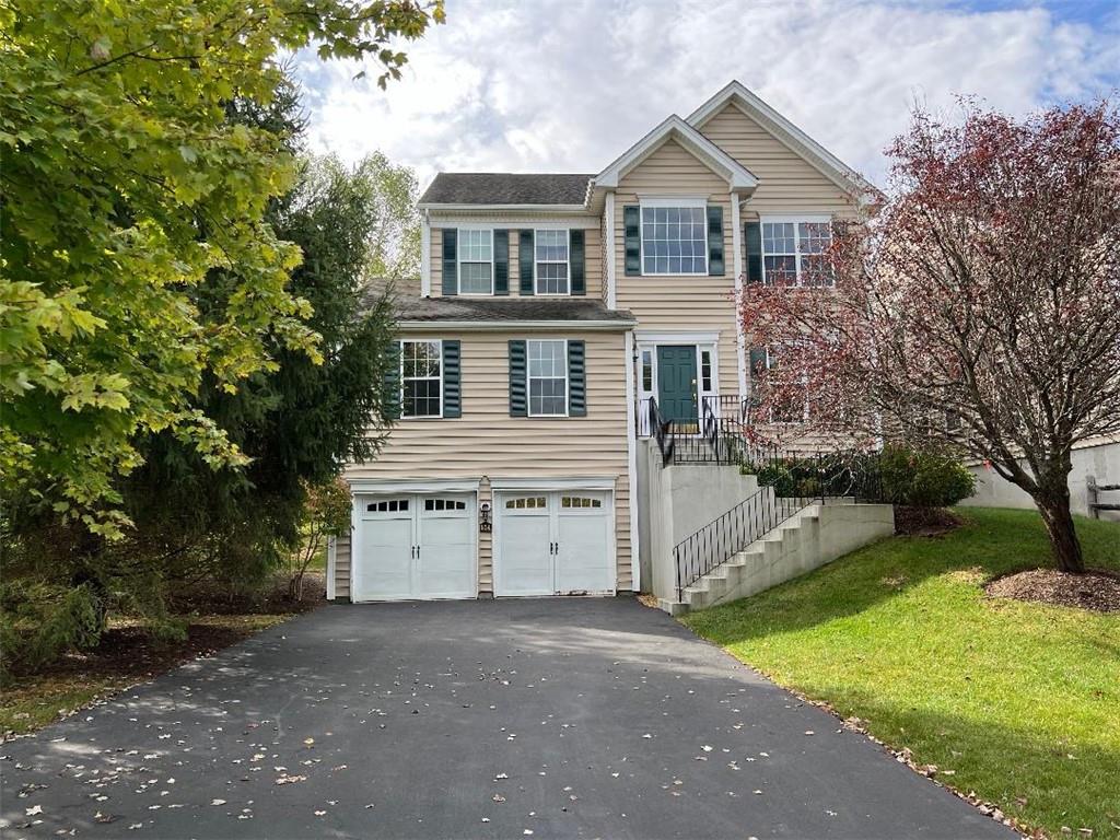 View of front of home featuring a garage