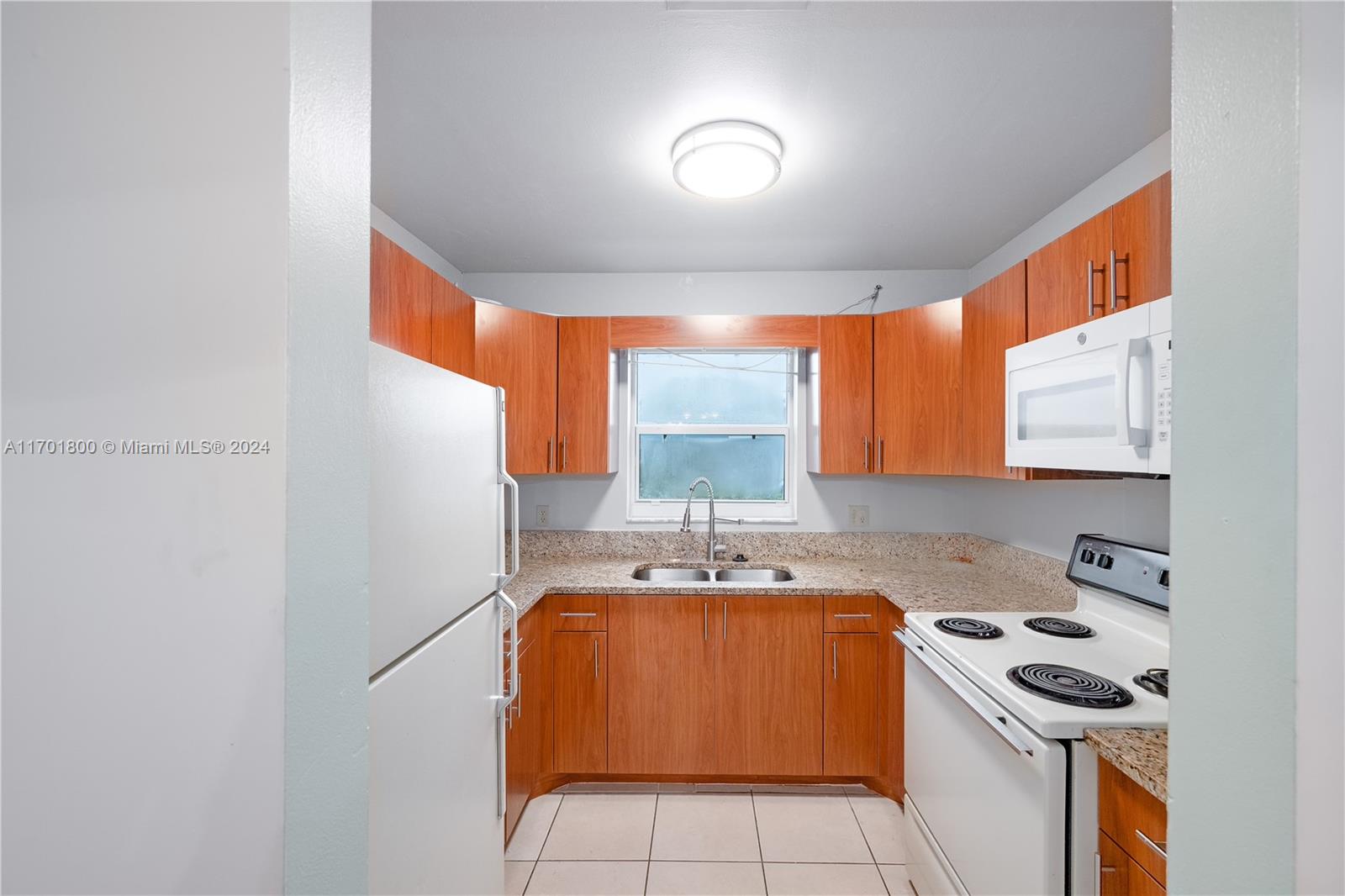 a kitchen that has a sink and a stove