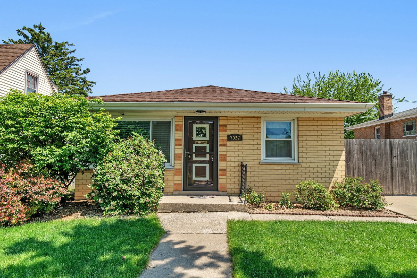 front view of a house with a yard