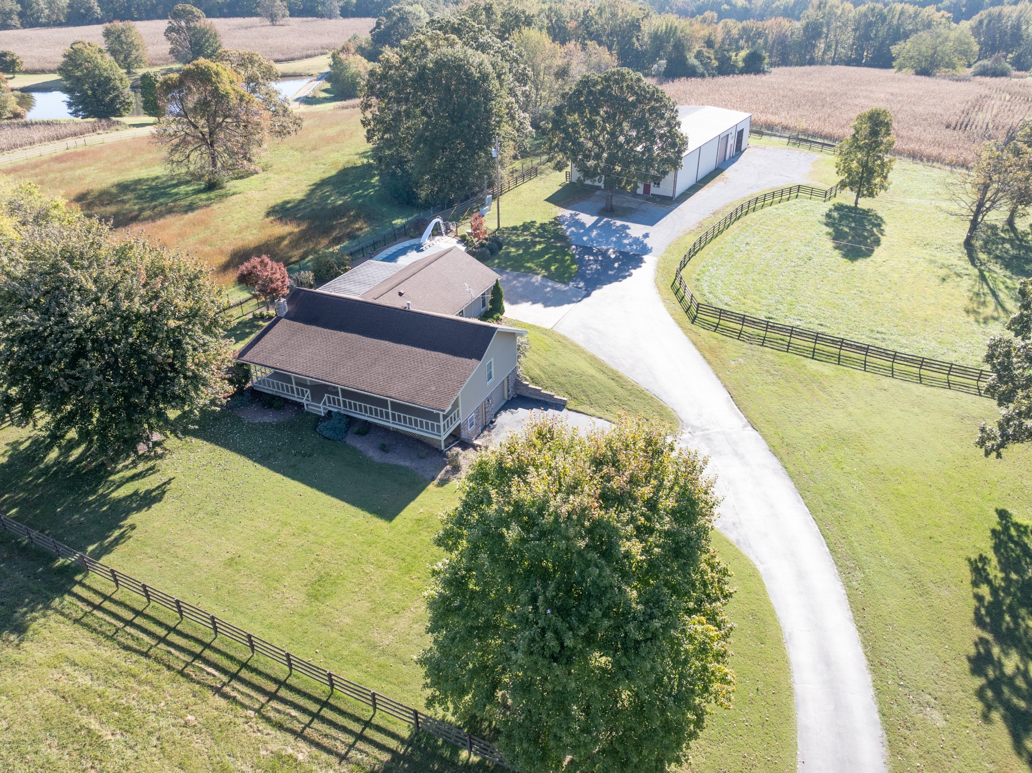 an aerial view of a house with a swimming pool