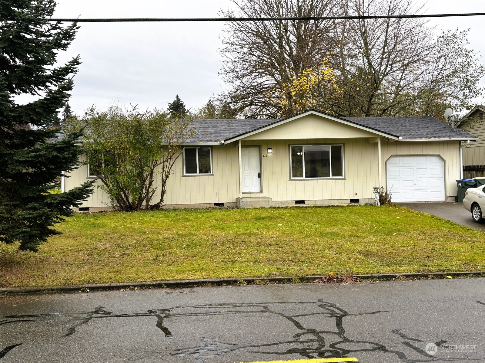 a front view of a house with garden