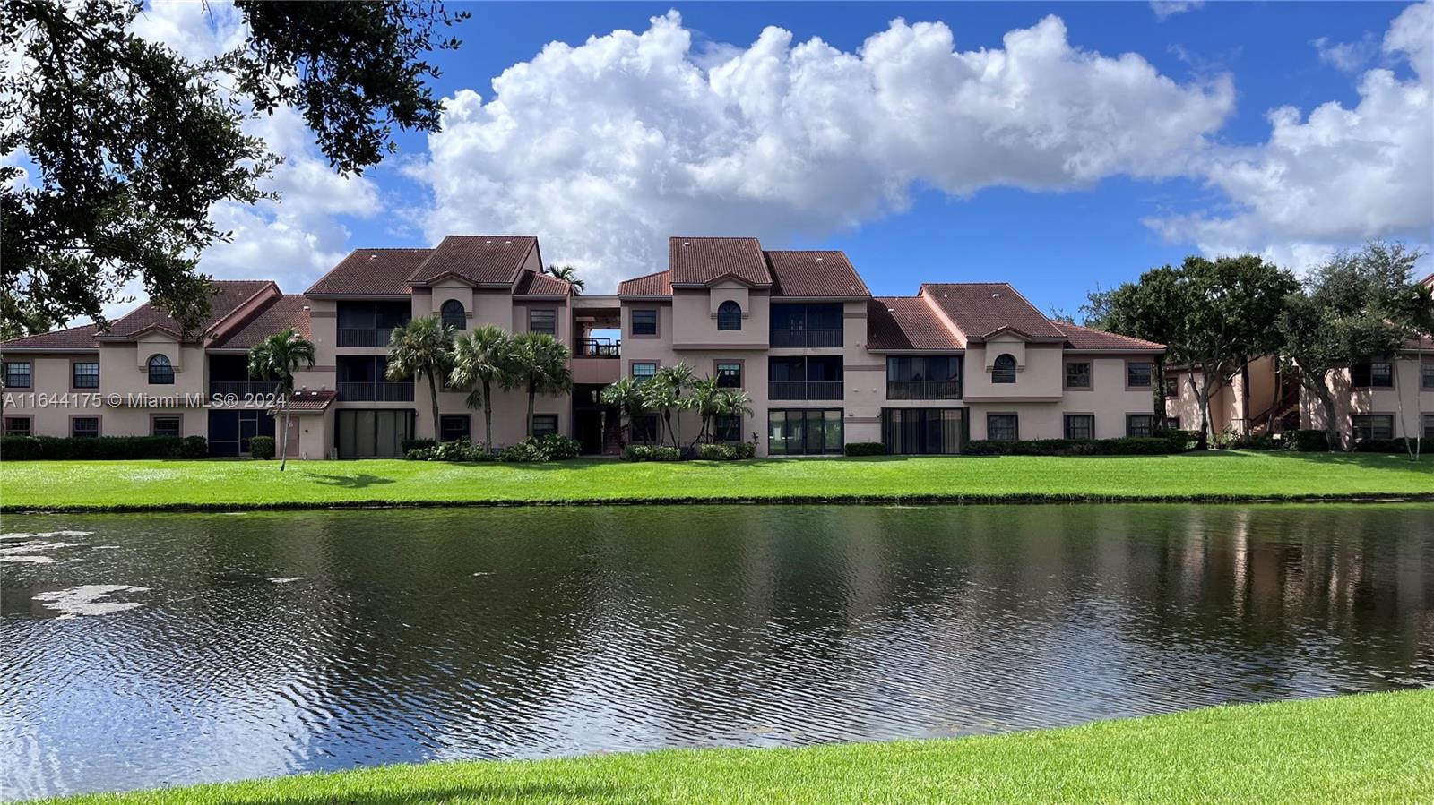 a view of building with river in front of it