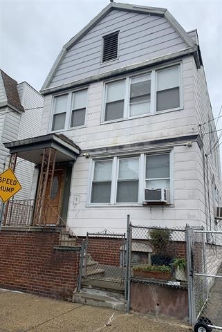 a view of a house with a window and balcony