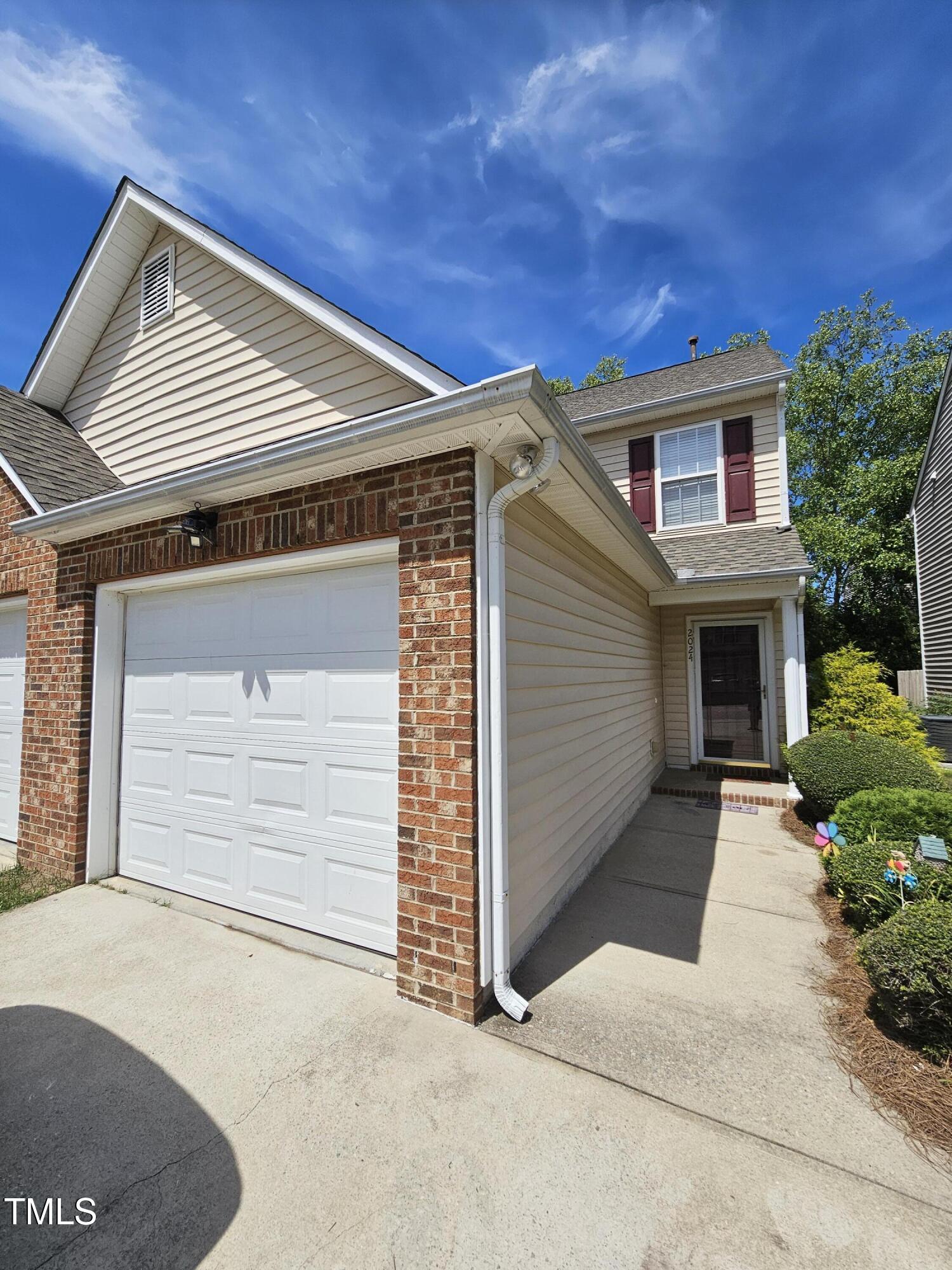 a front view of a house with a garage