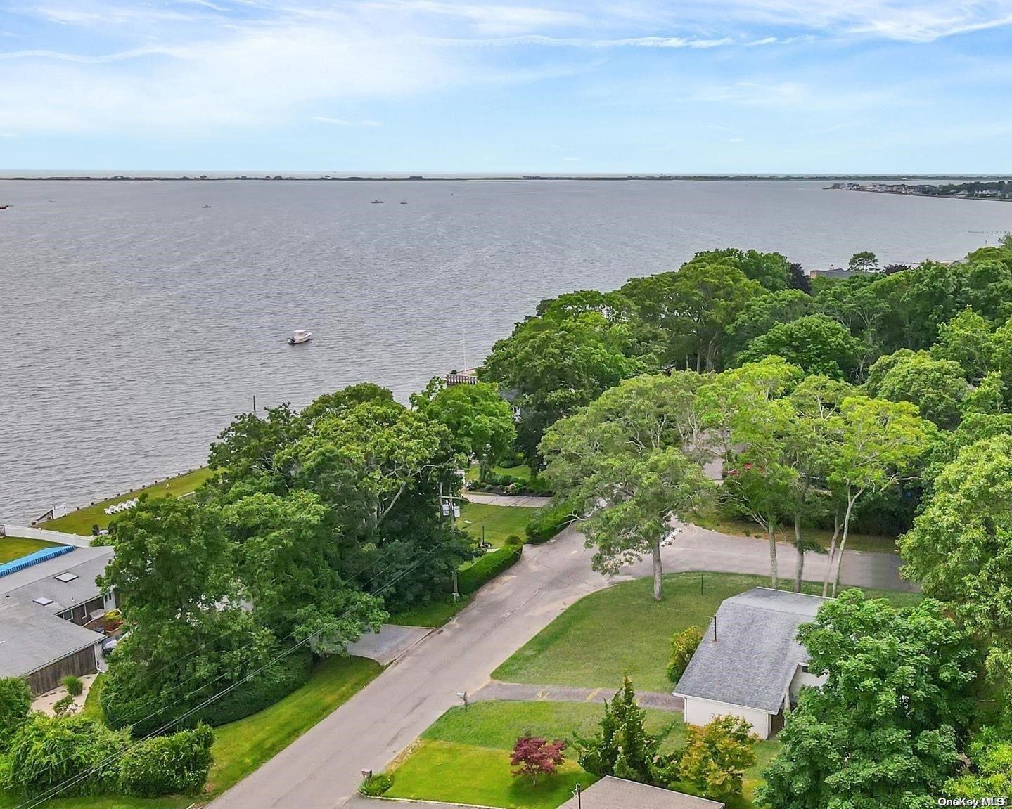 a view of a lake with a yard