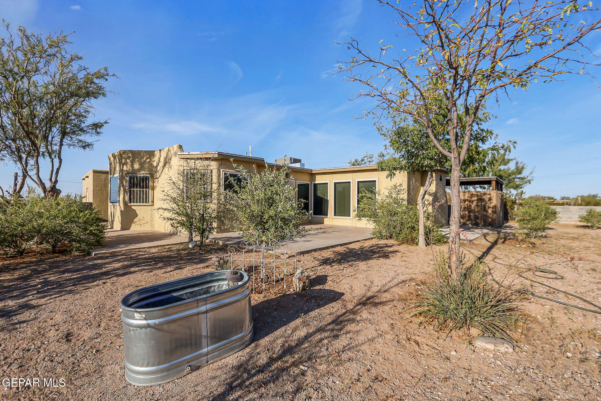 a view of a backyard with a patio