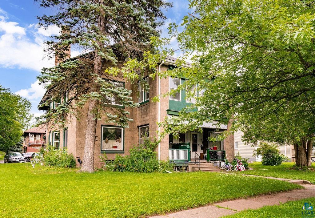 View of front of property with a front yard