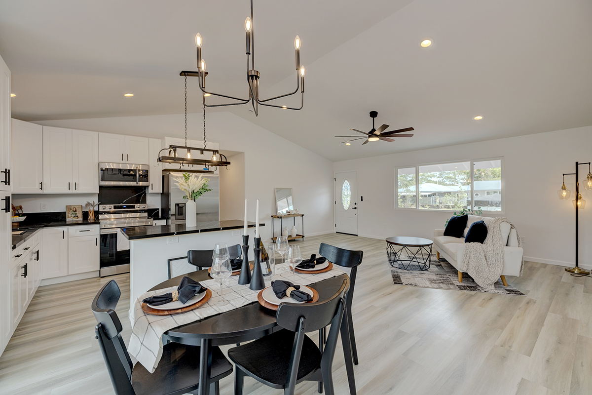 a large kitchen with a table and chairs