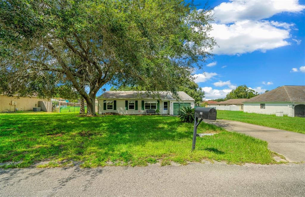 a view of a house with a yard