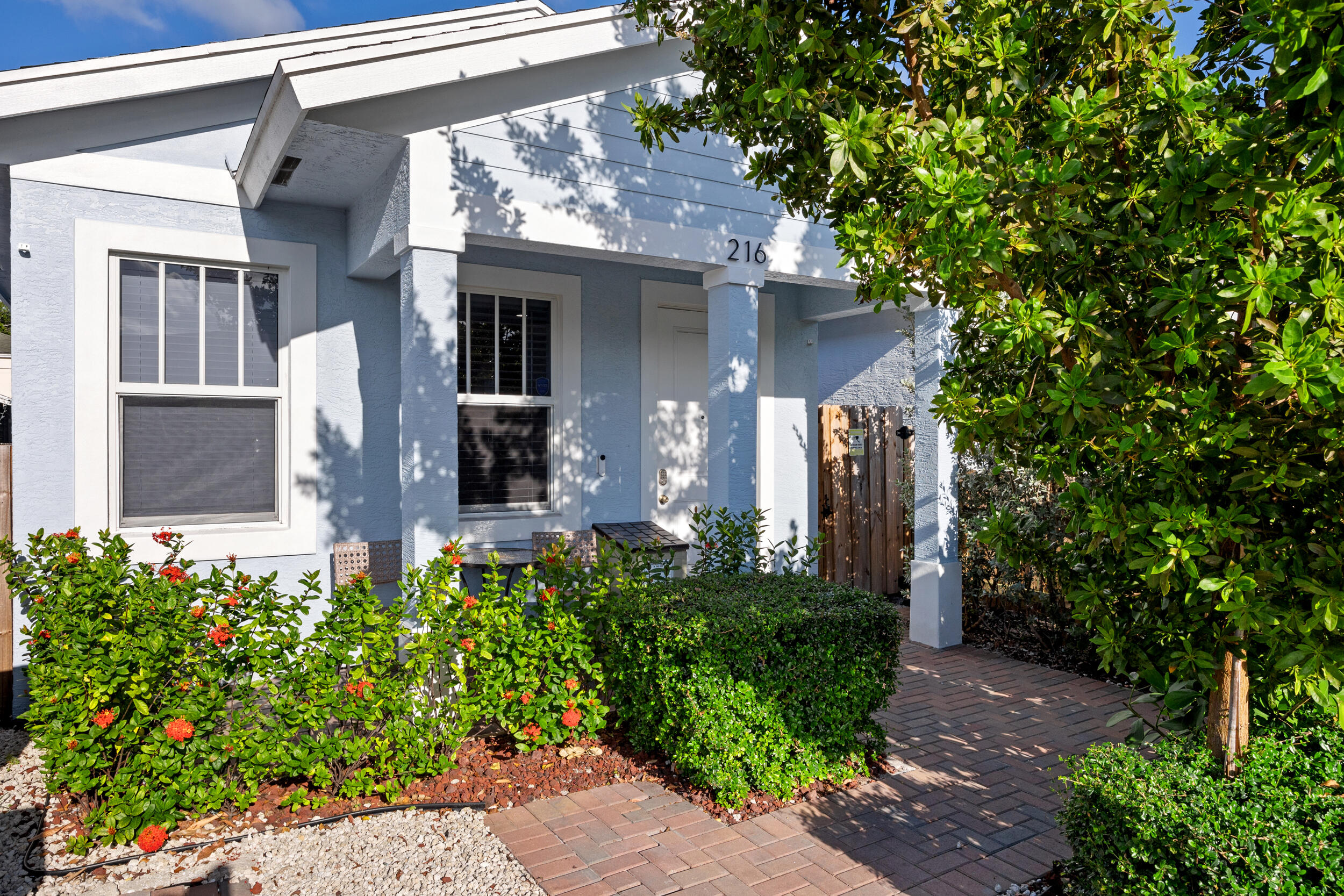 a front view of a house with garden