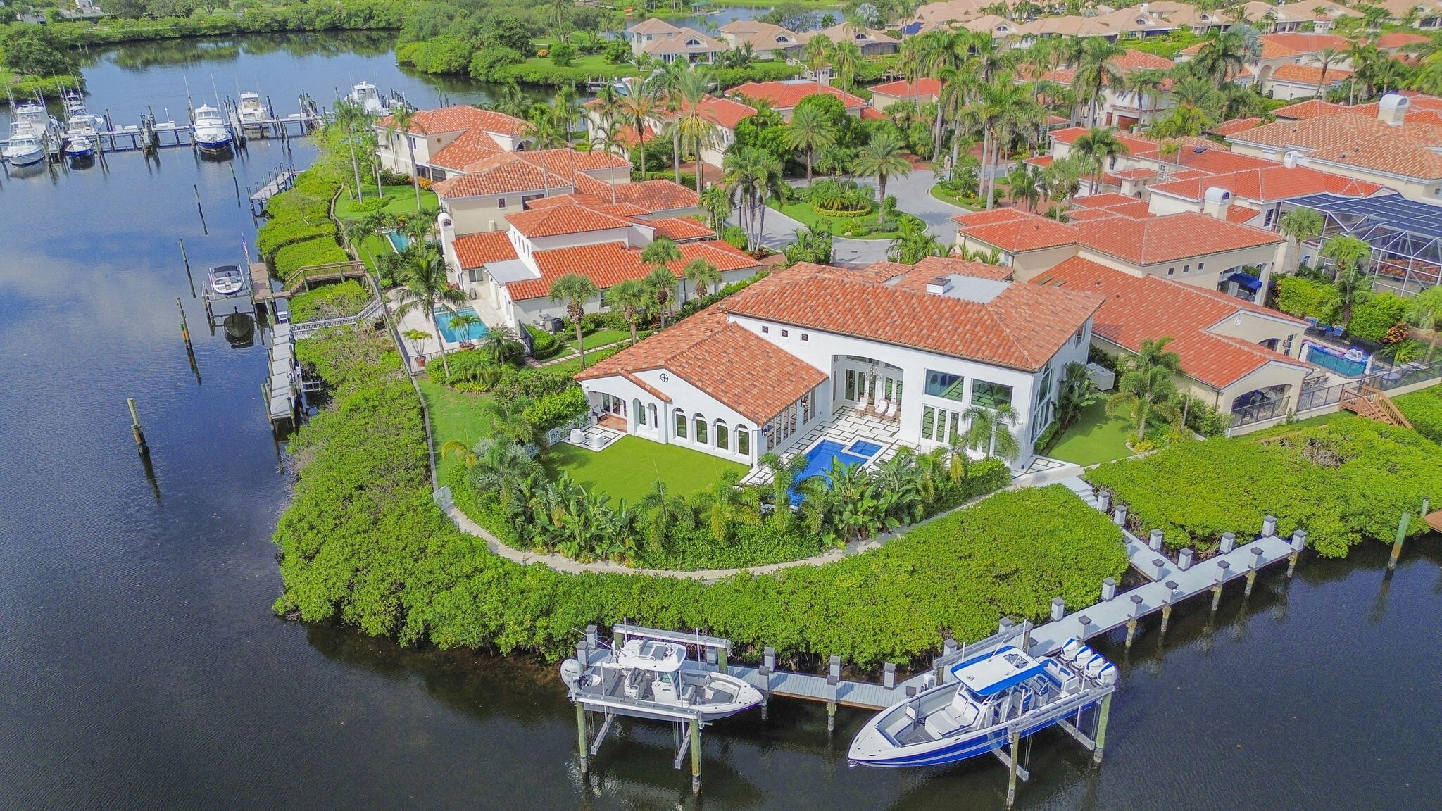 an aerial view of a house with garden space and street view