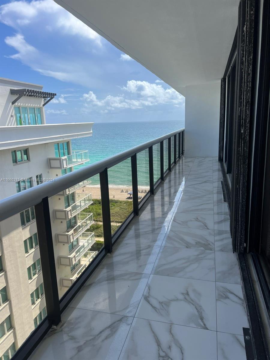 a view of balcony with furniture